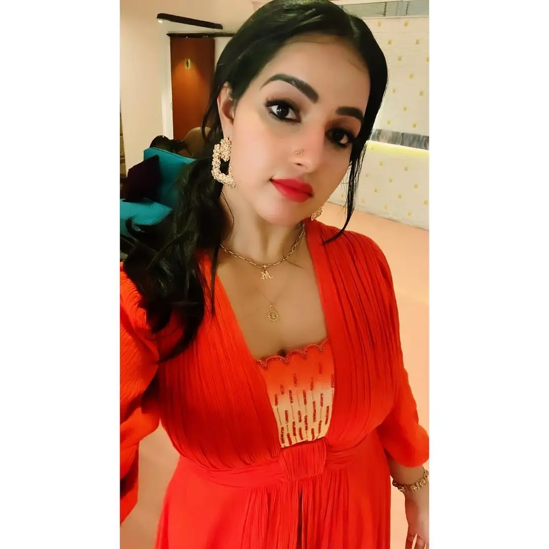 Malavika Menon In South Indian Traditional Orange Dress